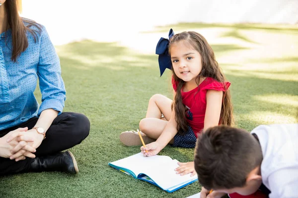 Beautiful Latin Little Preschooler Sitting Grass Enjoying Day School Outdoors — Stock Photo, Image