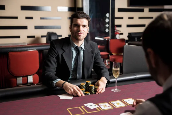 Portrait Serious Looking Latin Man Suit Holding Bunch Chips Poker — Stock Photo, Image