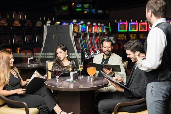 Group Friends Looking Some Menus Ordering Some Food Waiter Casino — Stock Photo, Image