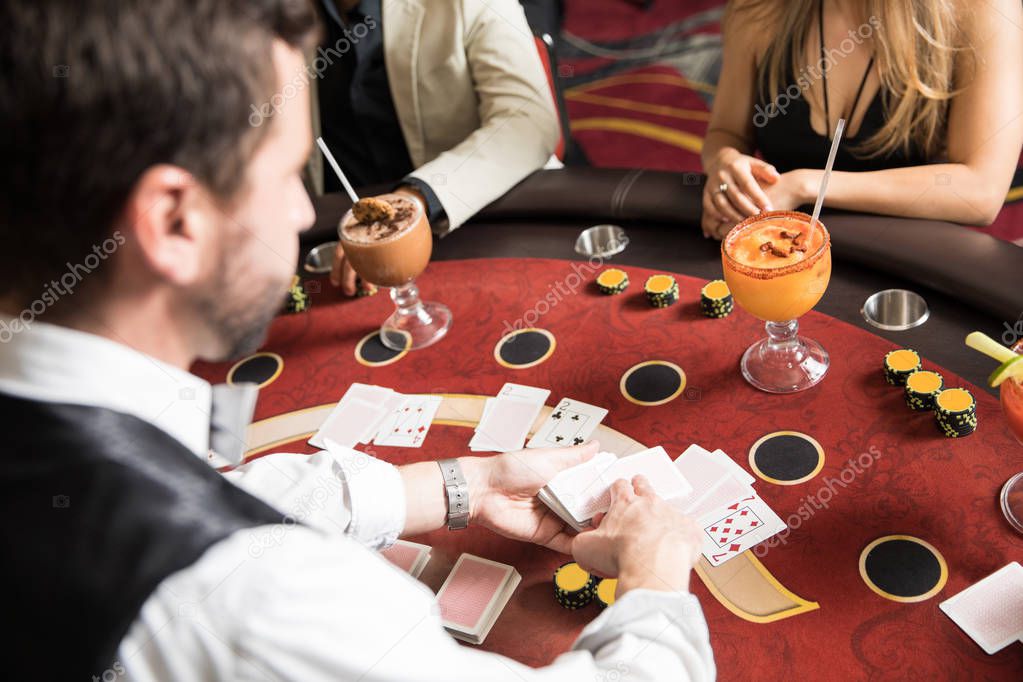 Point of view of a card dealer at work in a blackjack table in a casino