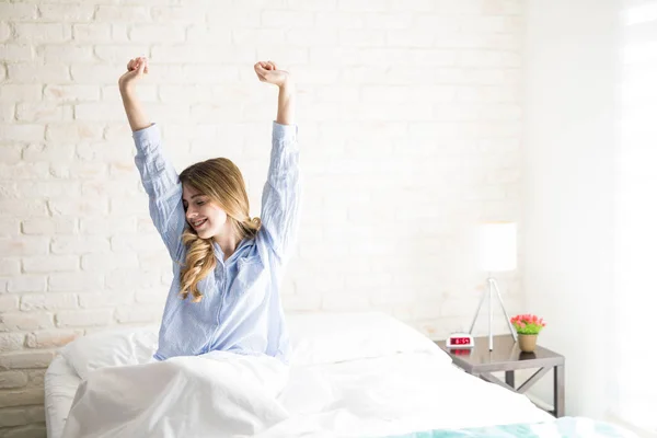 Young woman waking up in the morning — Stock Photo, Image