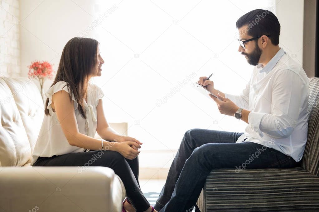 Young woman talking to therapist