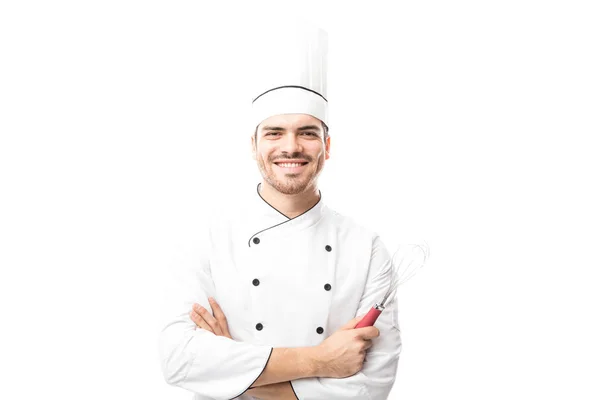 Bonito masculino chef segurando whisker — Fotografia de Stock