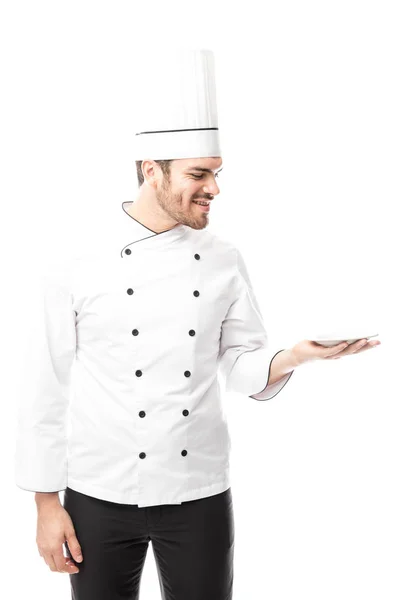 Bonito masculino chef segurando prato — Fotografia de Stock