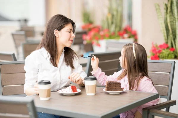 Daughter Feeding Cake Her Mother Cafe Blurred Background — Stock Photo, Image