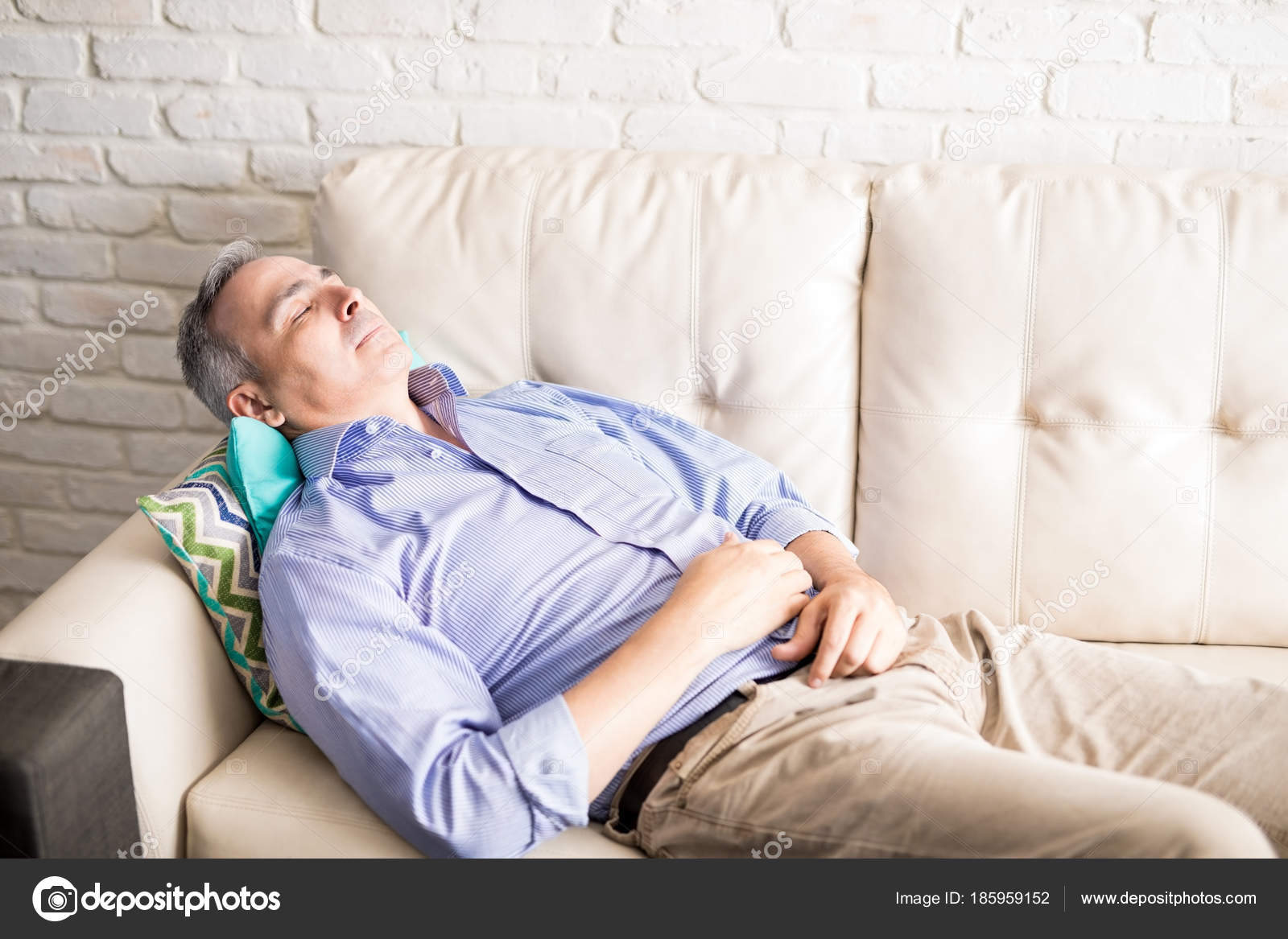 Hispanic Mature Man Gray Hair Relaxing Couch Home Interior Stock