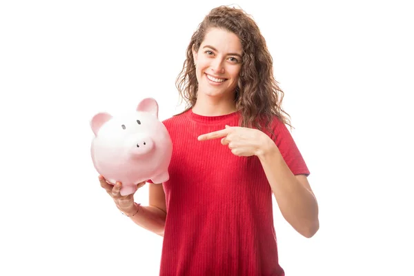 Gorgeous Young Caucasian Brunette Pointing Piggy Bank Isolated White Background — Stock Photo, Image