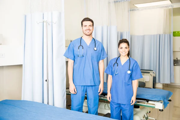 Two Young Doctors Wearing Scrubs Standing Empty Hospital Room — Stock Photo, Image