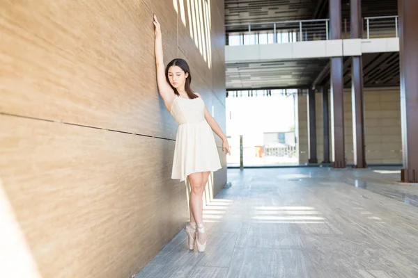 Young Ballerina Standing Tiptoe Hand Raised Wall Dance Performance Street — Stock Photo, Image