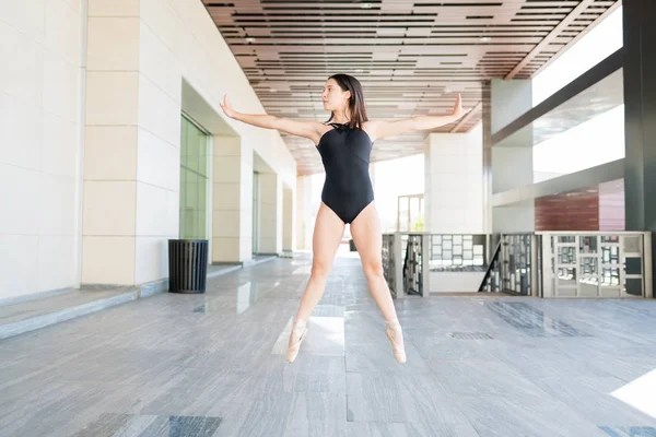 Female Ballerina Arms Outstretched Tiptoeing While Balancing Street City — Stock Photo, Image