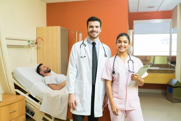 Portrait Male Female Doctors Standing Foreground Patient Hospital — Stok Foto