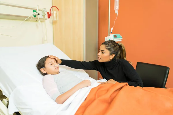 Mother Taking Care Little Daughter While Sitting Hospital Bed Treatment — Stock Photo, Image