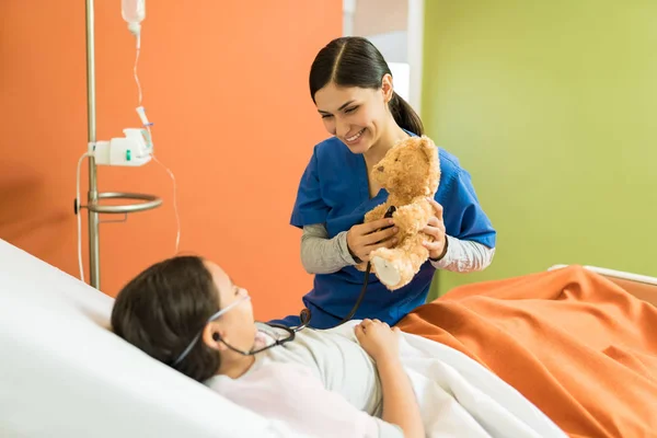 Young Nurse Girl Playing While Holding Teddybear Stethoscope Hospital — Stock Photo, Image