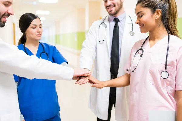 Hispanic Doctors Nurses Wearing Uniforms Stacking Hands Corridor Hospital — Stock Photo, Image