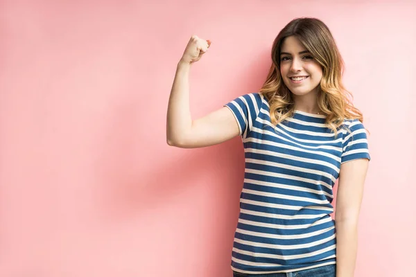 Happy Good Looking Woman Flexing Muscles Pink Background — ストック写真