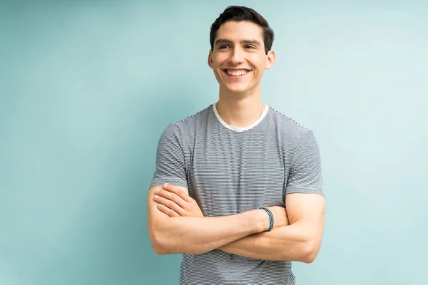 Happy Smart Young Male Standing Arms Crossed Blue Background — Stockfoto