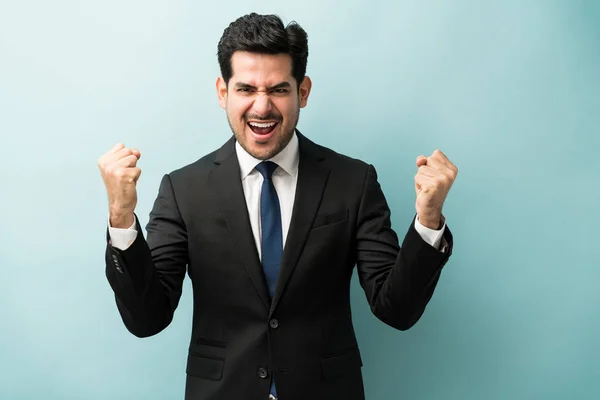 Happy Young Businessman Clenched Fist Enjoying Good News Colored Background — 스톡 사진