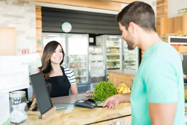 Happy Female Cashier Customer Checkout Counter Grocery Store — Stock Photo, Image