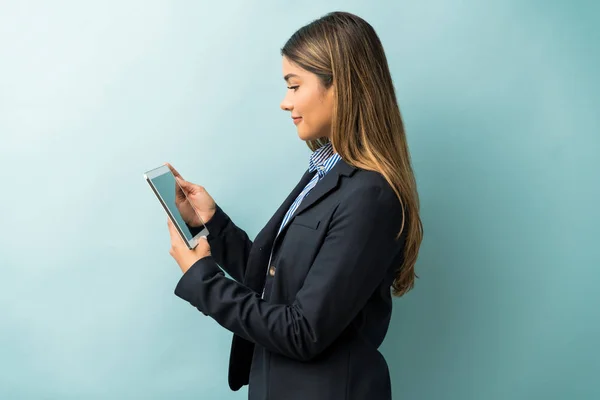 Side View Female Professional Looking Digital Tablet While Standing Colored — Stock Photo, Image