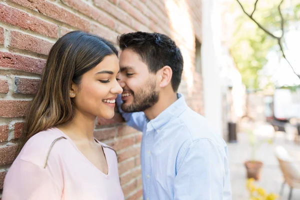 Smiling Romantic Hispanic Couple Leaning Brick Wall — Stok fotoğraf