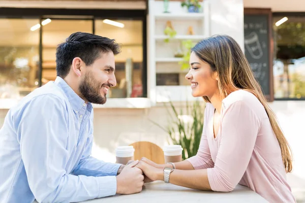 Side View Happy Boyfriend Girlfriend Holding Hands While Sitting Sidewalk — Stock Photo, Image