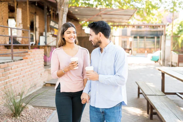Happy Boyfriend Girlfriend Holding Disposable Coffee Cups While Walking Footpath — Stock Photo, Image