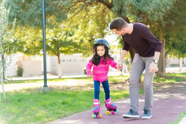 Full Length Man Holding Daughter Hand While Assisting Skating Sidewalk — Stok Foto