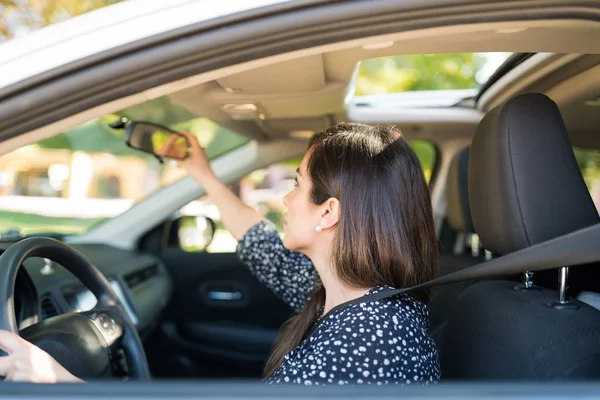Mid Adult Latin Woman Adjusting Rearview Mirror Car — Stock Photo, Image