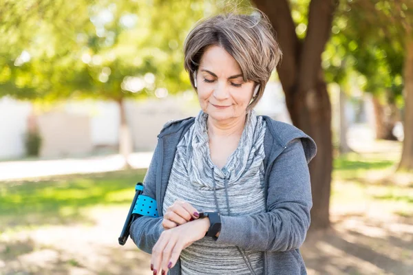 Confident Retired Senior Woman Looking Smartwatch Wrist City — Stock Photo, Image