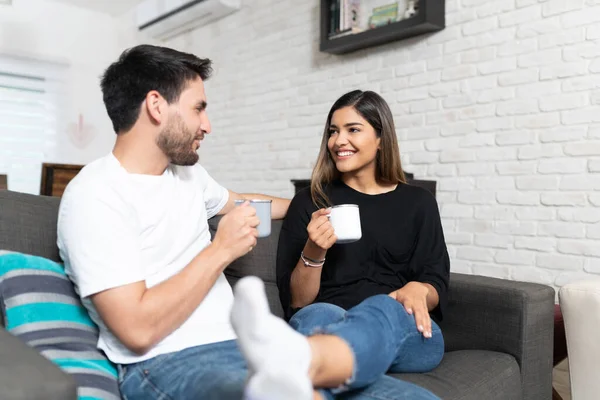 Happy Hispanic Heterosexual Couple Drinking Coffee While Sitting Couch Living — Stock Photo, Image