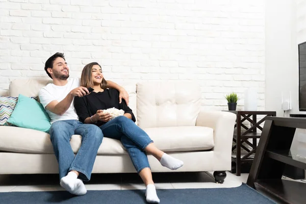 Latin Couple Watching Movie While Sitting Sofa Living Room Home — Stock Photo, Image