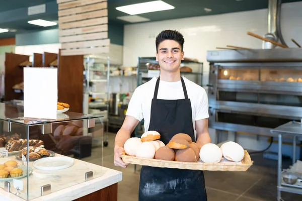 Portrait Handsome Hispanic Baker Showing Tray Full Sweet Bread Bakery — Stock Photo, Image