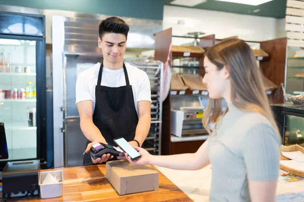 Young Caucasian Woman Paying Bakery Shop Her Smartphone Checkout Counter — Stock Photo, Image