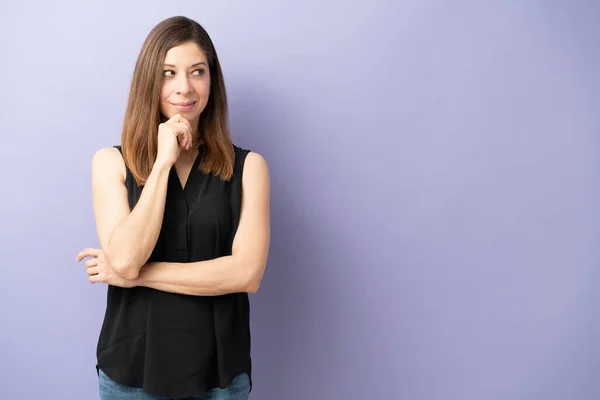 Attractive Brunette Woman Gazing Copy Space While Looking Thoughtful Studio — ストック写真