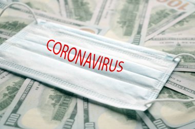 Dolar üzerine kurulu tıbbi maske, Coronavirus ya da Covid19 gibi virüsün korunması için artan maliyet kavramı.