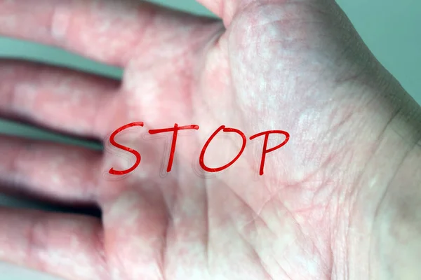 Coronavirus. A human hand with STOP message, Stop Covid - 19 Worldwide