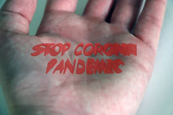 Coronavirus. A human hand with STOP message, Stop Covid - 19 Worldwide