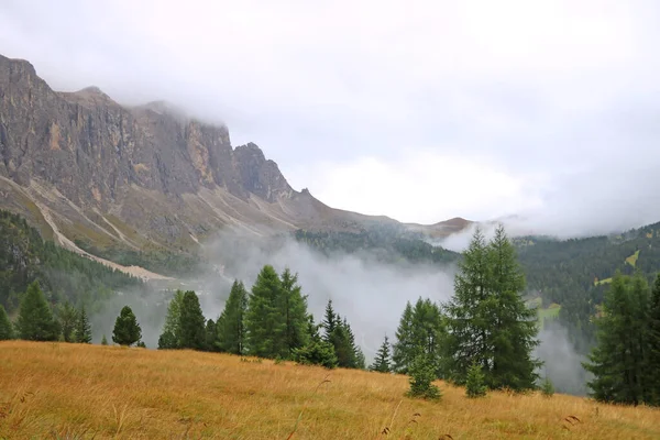 Foggy mountain landscape in Dolomites in Italy