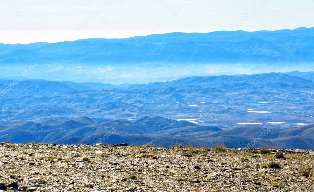 Panoramic view of Calar Alto Observatory at the snowy mountain top in Almeria, Andalusia, Spain, 2019.
