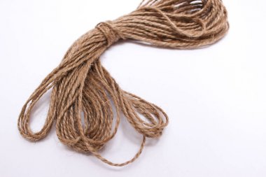 Brown solid thread, string twine. Spool of thread