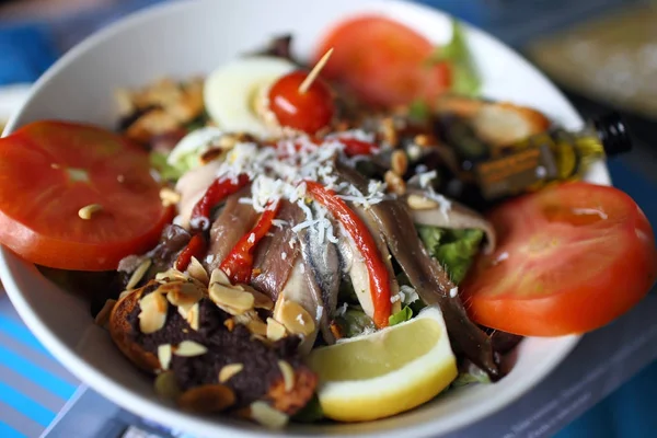 Vegetable salad with anchovies — Stock Photo, Image