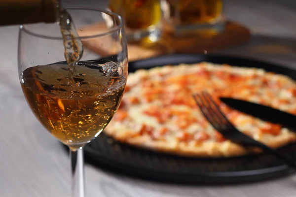 Pouring white wine into glass — Stock Photo, Image