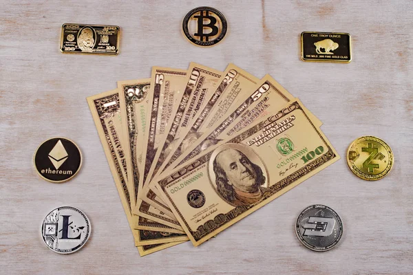 Golden dollar bills surrounded by cryptocurrency gold and silver coins Bitcoin ethereum dash On white wood surface