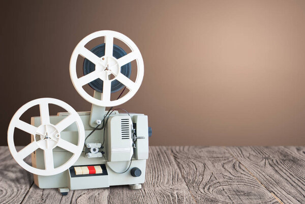 Vintage projector on a wooden table