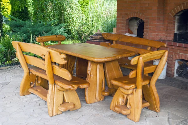 Wooden furniture for giving a table and benches