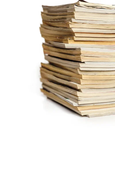 A stack of magazines on a white background — Stock Photo, Image