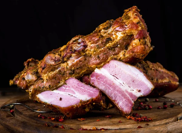 smoked pork ribs on wooden cutting board