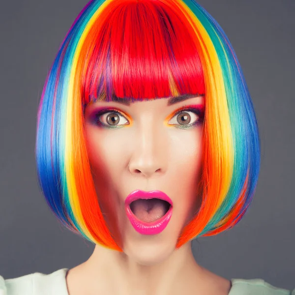 Beautiful woman wearing colorful wig — Stock Photo, Image