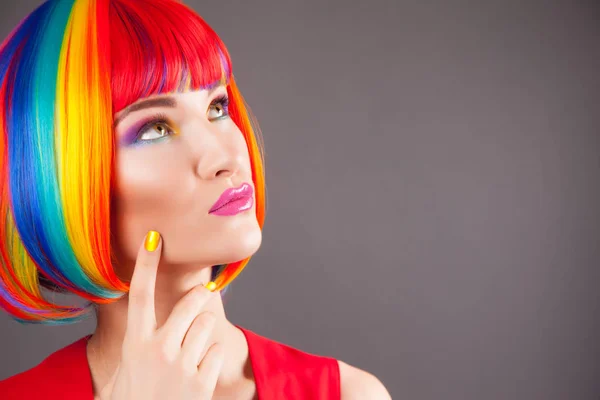 Beautiful woman wearing colorful wig — Stock Photo, Image