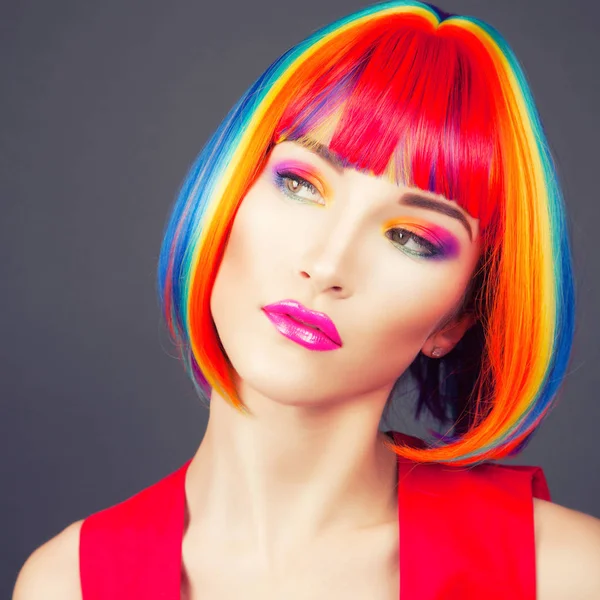 Beautiful woman wearing colorful wig — Stock Photo, Image